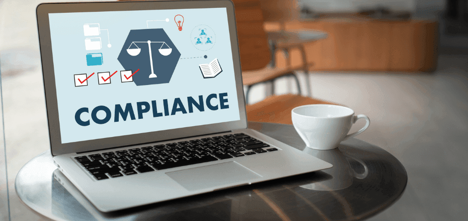 Laptop displaying compliance concepts with scales of justice, checklists, and monitoring icons, representing the human oversight needed for IDD group home inspections that AI cannot replace.